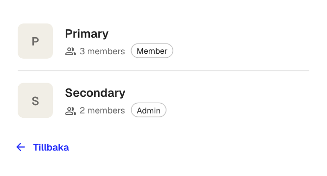 The workspace picker showing two workspaces with member counts and your role